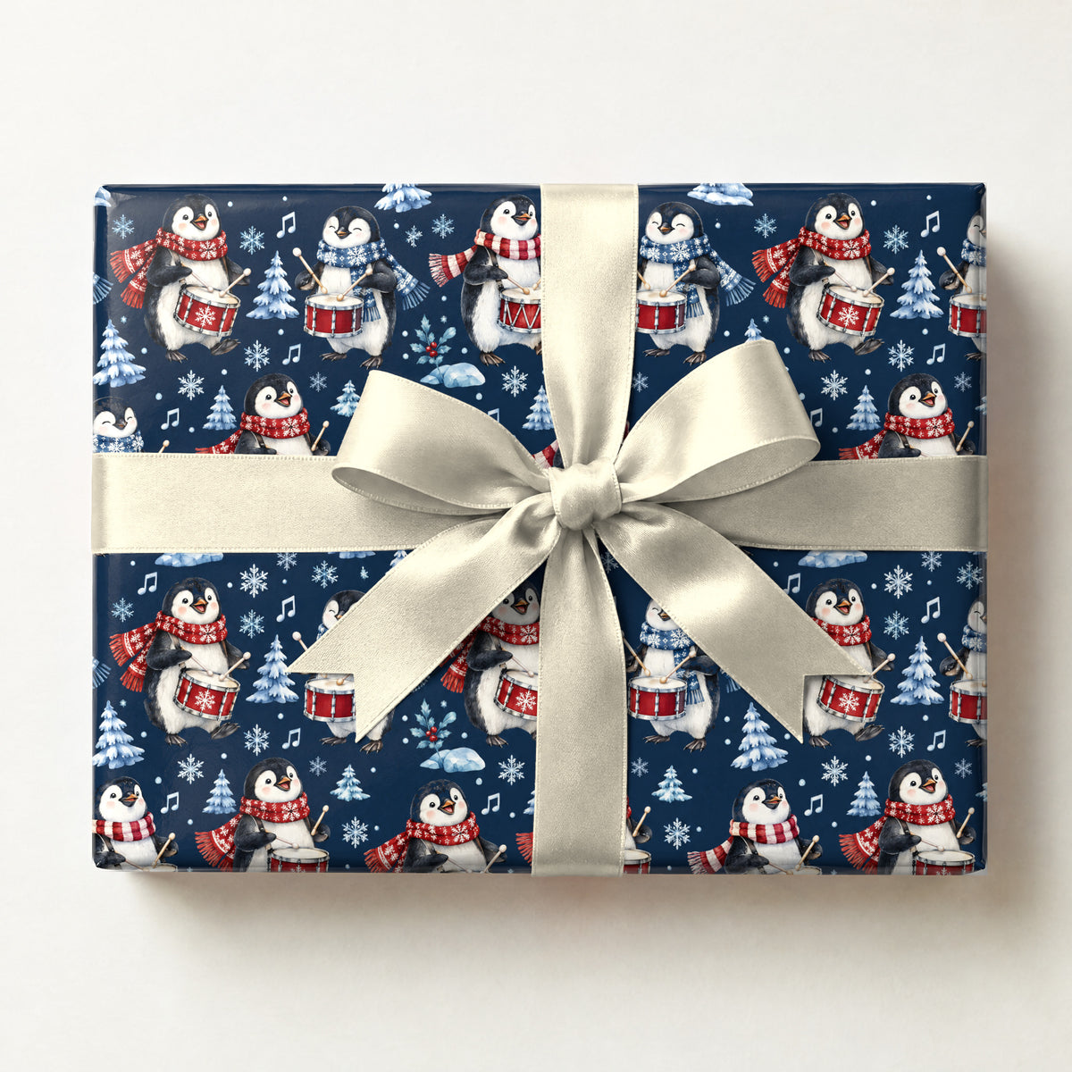 Penguin Drum Solo Wrapping Paper, a gift box wrapped in it and tied with a satin ribbon