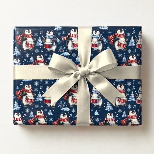 Penguin Drum Solo Wrapping Paper, a gift box wrapped in it and tied with a satin ribbon