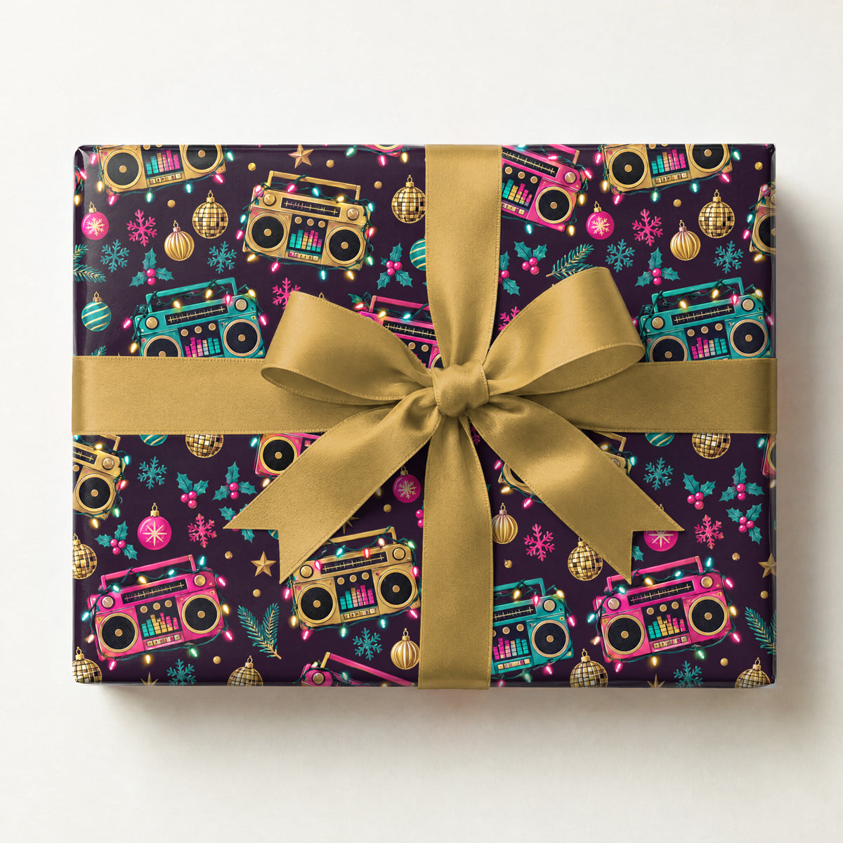 Holiday Boombox Glow Wrapping Paper, a gift box wrapped in it and tied with a satin ribbon