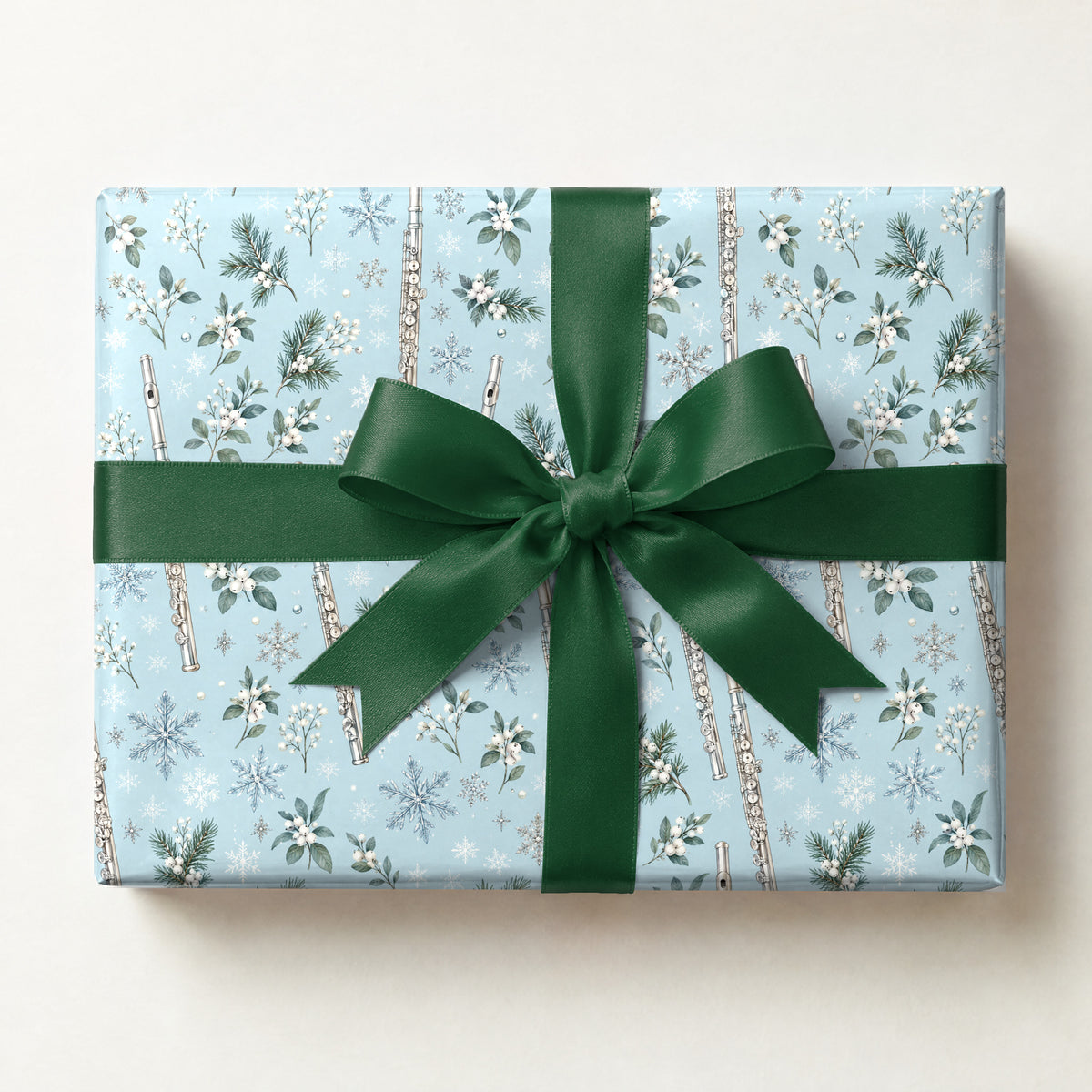 Flurries and Flutes Wrapping Paper, a gift box wrapped in it and tied with a satin ribbon
