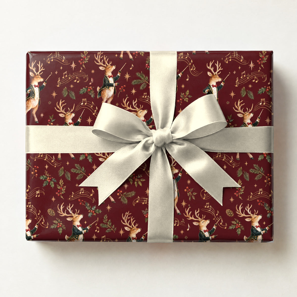 Reindeer Conductor Wrapping Paper, a gift box wrapped in it and tied with a satin ribbon
