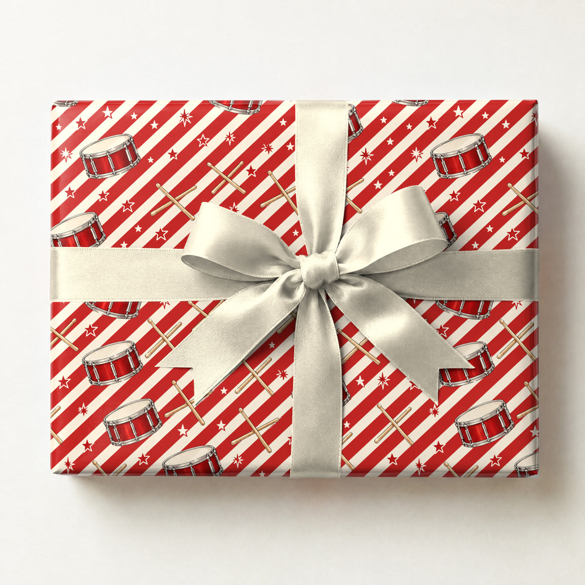 Peppermint Drumstick Stripe Wrapping Paper, a gift box wrapped in it and tied with a satin ribbon