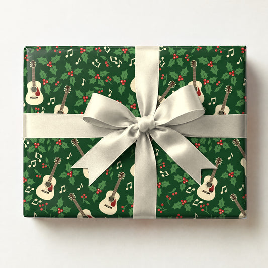 Holly Jolly Acoustic Guitar Wrapping Paper, a gift box wrapped in it and tied with a satin ribbon