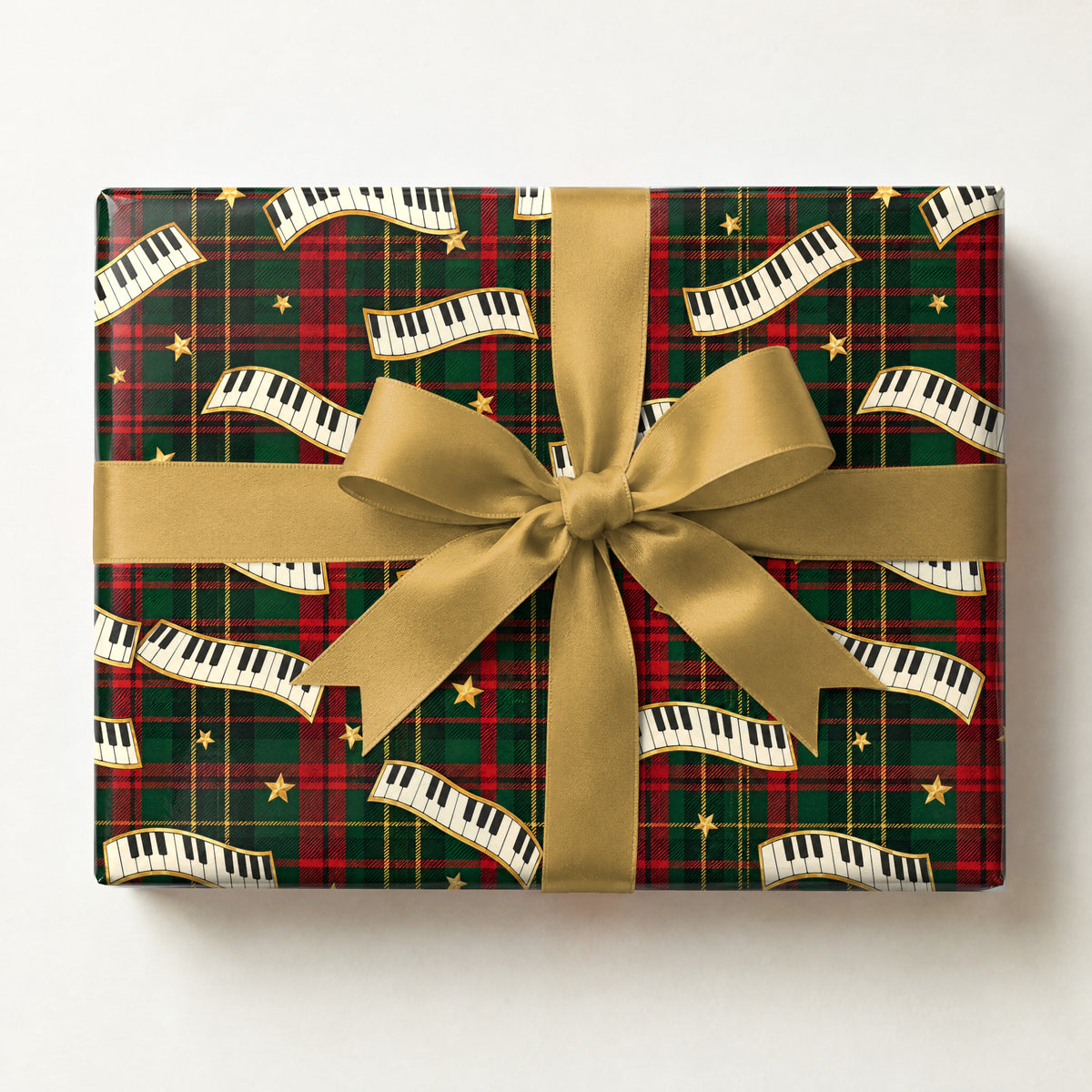 Holiday Plaid Piano Keys Wrapping Paper, a gift box wrapped in it and tied with a satin ribbon