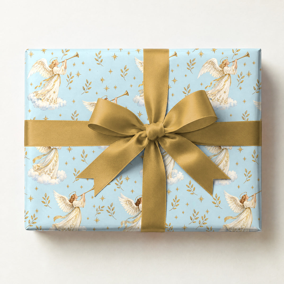 Angel Trumpet Fanfare Wrapping Paper, a gift box wrapped in it and tied with a satin ribbon