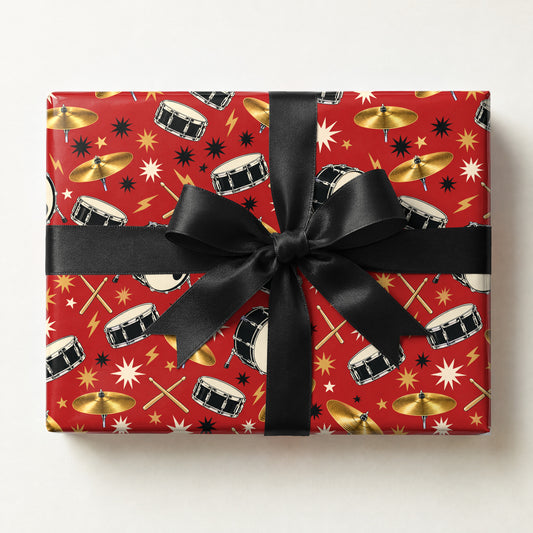 Drummer Wrapping Paper, a gift box wrapped in it and tied with a satin ribbon