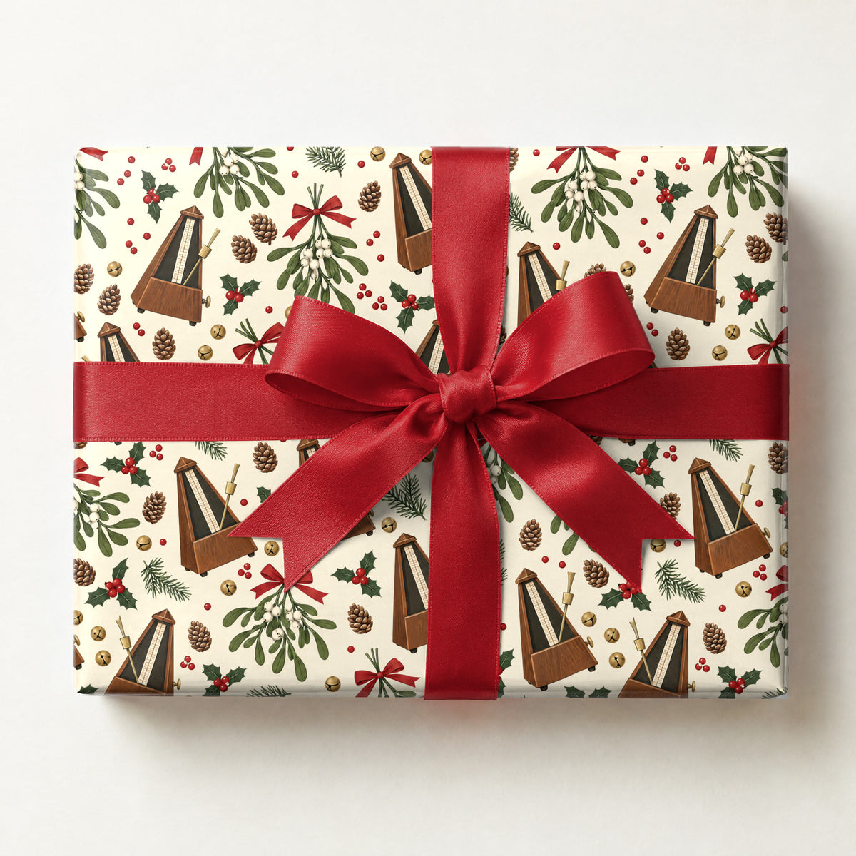 Metronome and Mistletoe Wrapping Paper, a gift box wrapped in it and tied with a satin ribbon