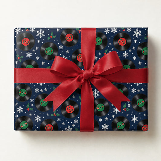 Vinyl Snowfall Christmas Wrapping Paper, a gift box wrapped in it and tied with a satin ribbon