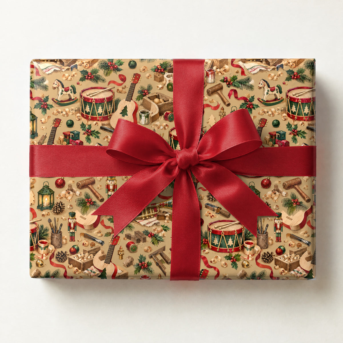 Santa's Instrument Workshop Wrapping Paper, a gift box wrapped in it and tied with a satin ribbon