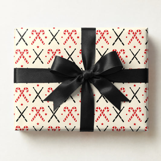 Drumstick Candy Cane Cross Wrapping Paper, a gift box wrapped in it and tied with a satin ribbon