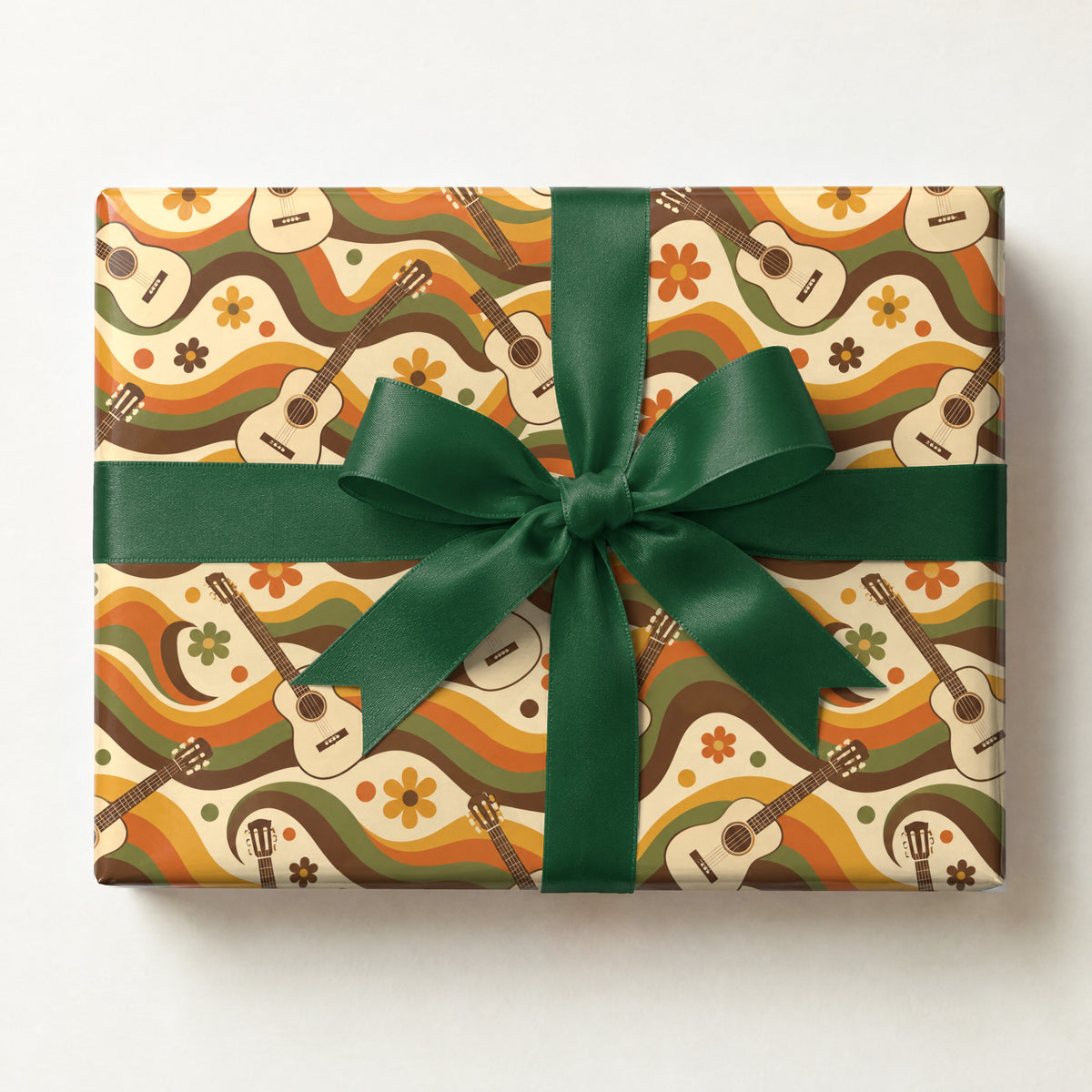 Groovy Guitar Waves Retro Wrapping Paper, a gift box wrapped in it and tied with a satin ribbon
