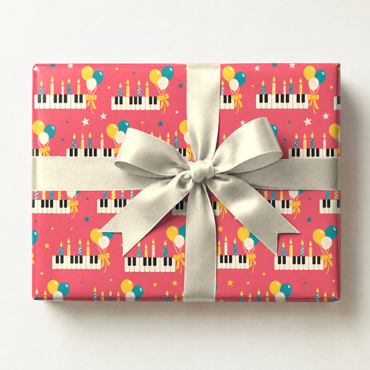Birthday Piano Balloons Wrapping Paper, a gift box wrapped in it and tied with a satin ribbon