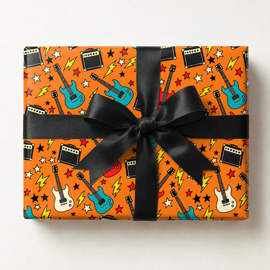 Guitar and Amp Rock Wrapping Paper, a gift box wrapped in it and tied with a satin ribbon