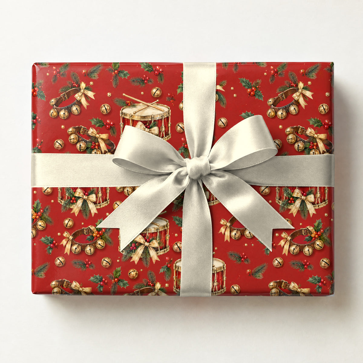 Snare and Sleigh Bells Wrapping Paper, a gift box wrapped in it and tied with a satin ribbon