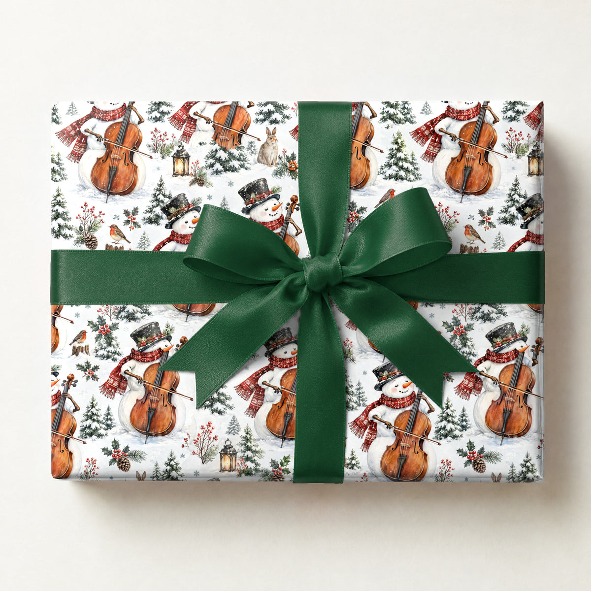 Snowman Cello Serenade Wrapping Paper, a gift box wrapped in it and tied with a satin ribbon