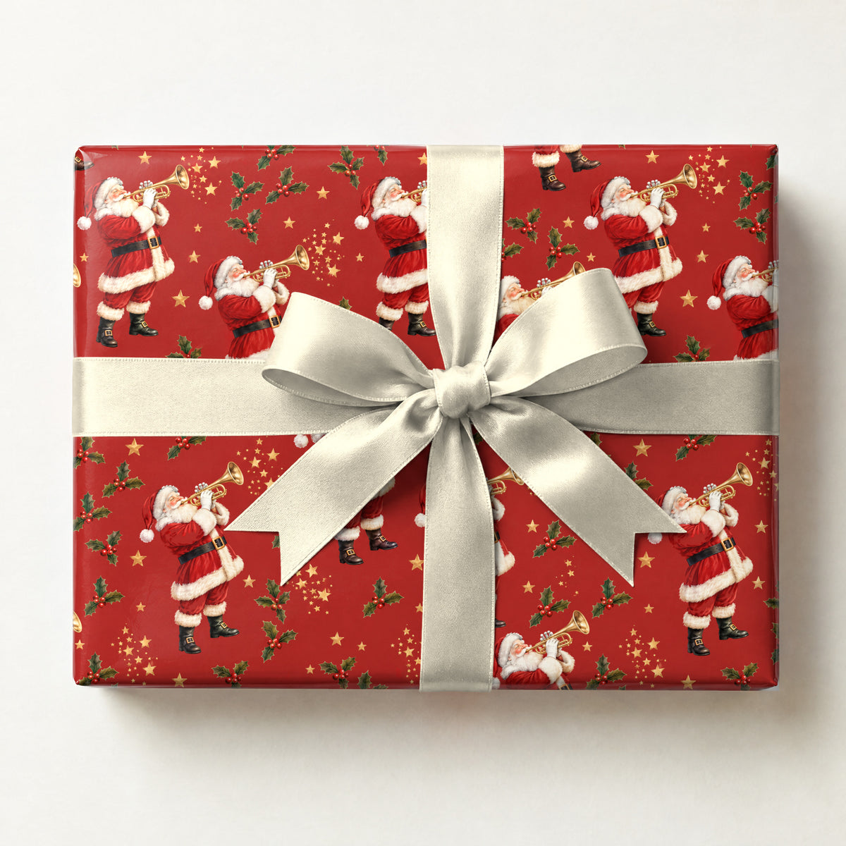 Santa's Trumpet Fanfare Wrapping Paper, a gift box wrapped in it and tied with a satin ribbon
