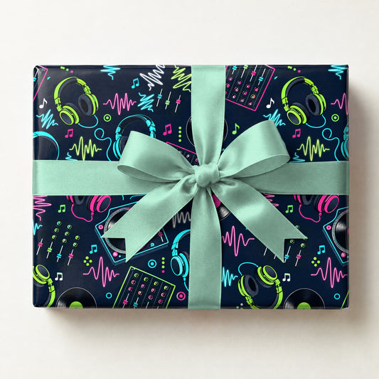 DJ Headphones Wrapping Paper, a gift box wrapped in it and tied with a satin ribbon
