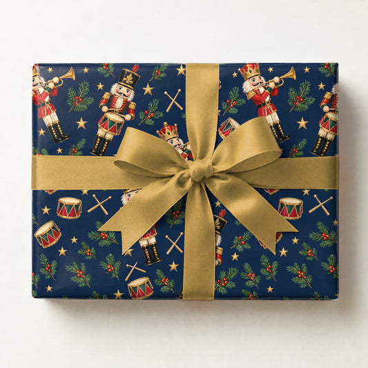 Nutcracker Drummers Wrapping Paper, a gift box wrapped in it and tied with a satin ribbon