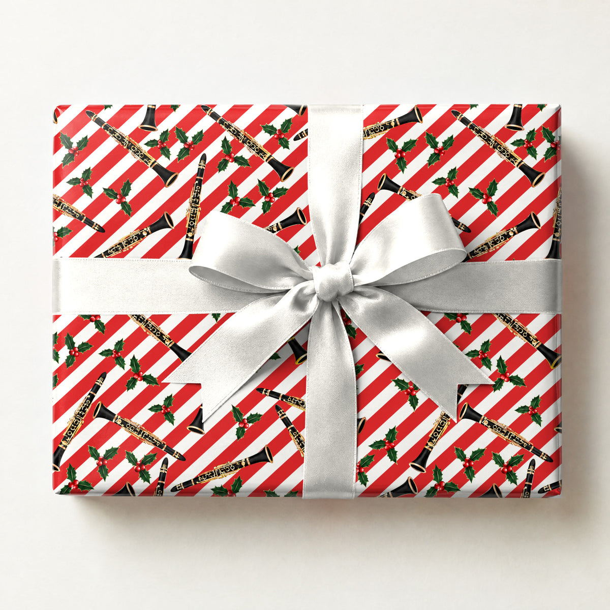 Cane and Clarinet Wrapping Paper, a gift box wrapped in it and tied with a satin ribbon