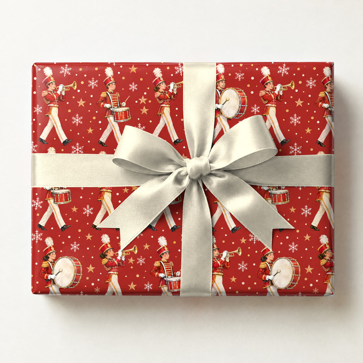 Holiday Marching Band Parade Wrapping Paper, a gift box wrapped in it and tied with a satin ribbon