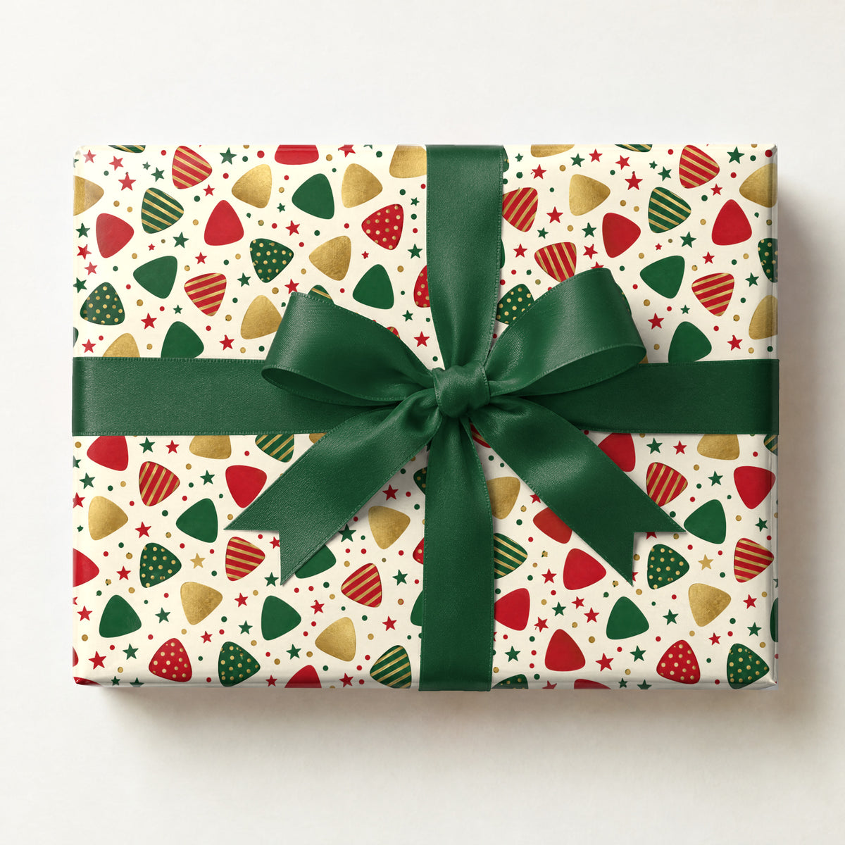 Guitar Pick Confetti Holiday Wrapping Paper, a gift box wrapped in it and tied with a satin ribbon
