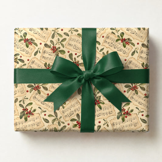 Sheet Music Mistletoe Wrapping Paper, a gift box wrapped in it and tied with a satin ribbon