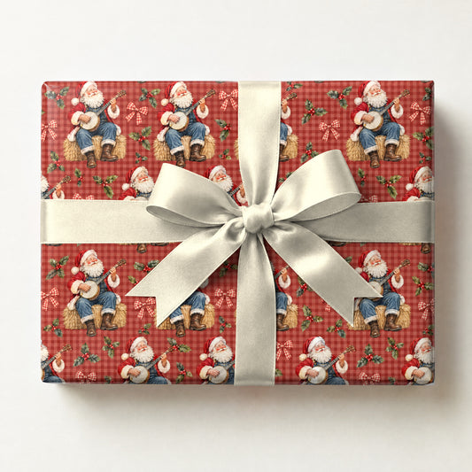 Santa's Banjo Hoedown Wrapping Paper, a gift box wrapped in it and tied with a satin ribbon