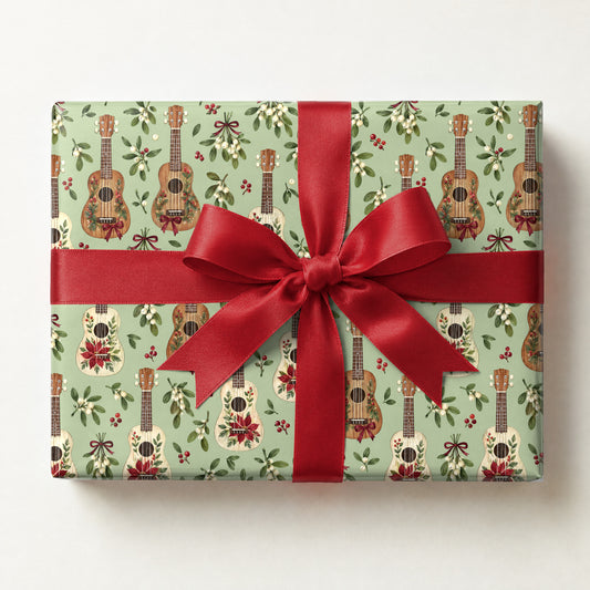 Ukulele Mistletoe Scatter Wrapping Paper, a gift box wrapped in it and tied with a satin ribbon