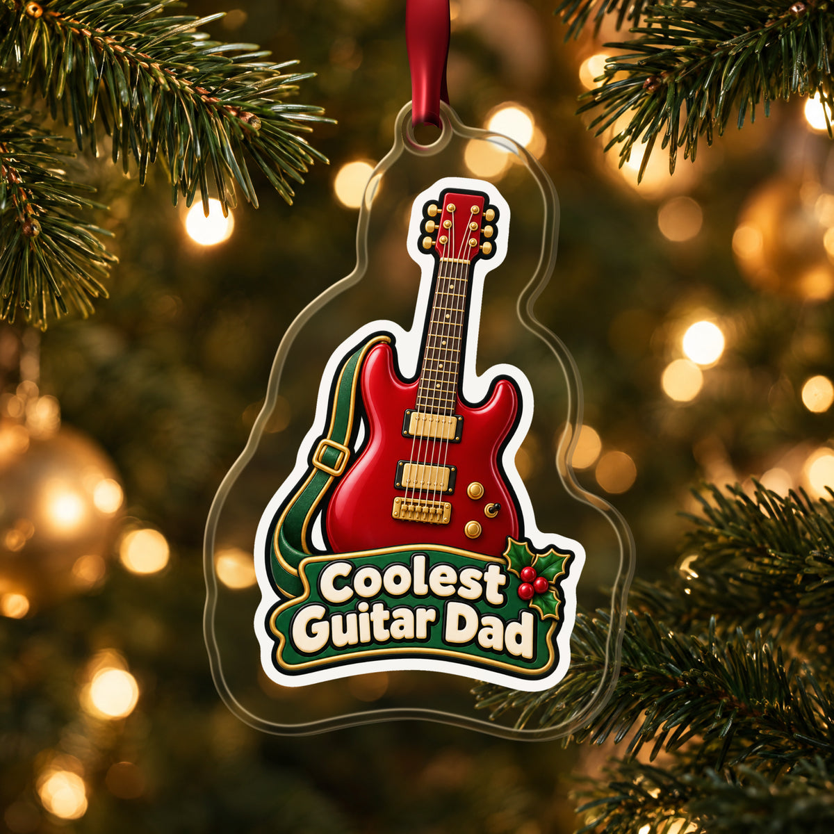 Coolest Guitar Dad clear acrylic Christmas ornament hanging on a lit Christmas tree with warm gold lights