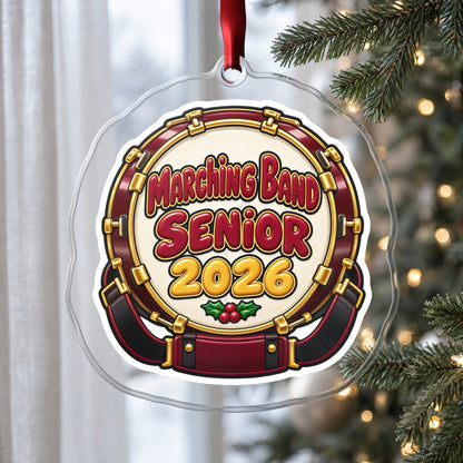 Marching Band Senior 2026 clear acrylic Christmas ornament hanging on a Christmas tree by a window in soft daylight