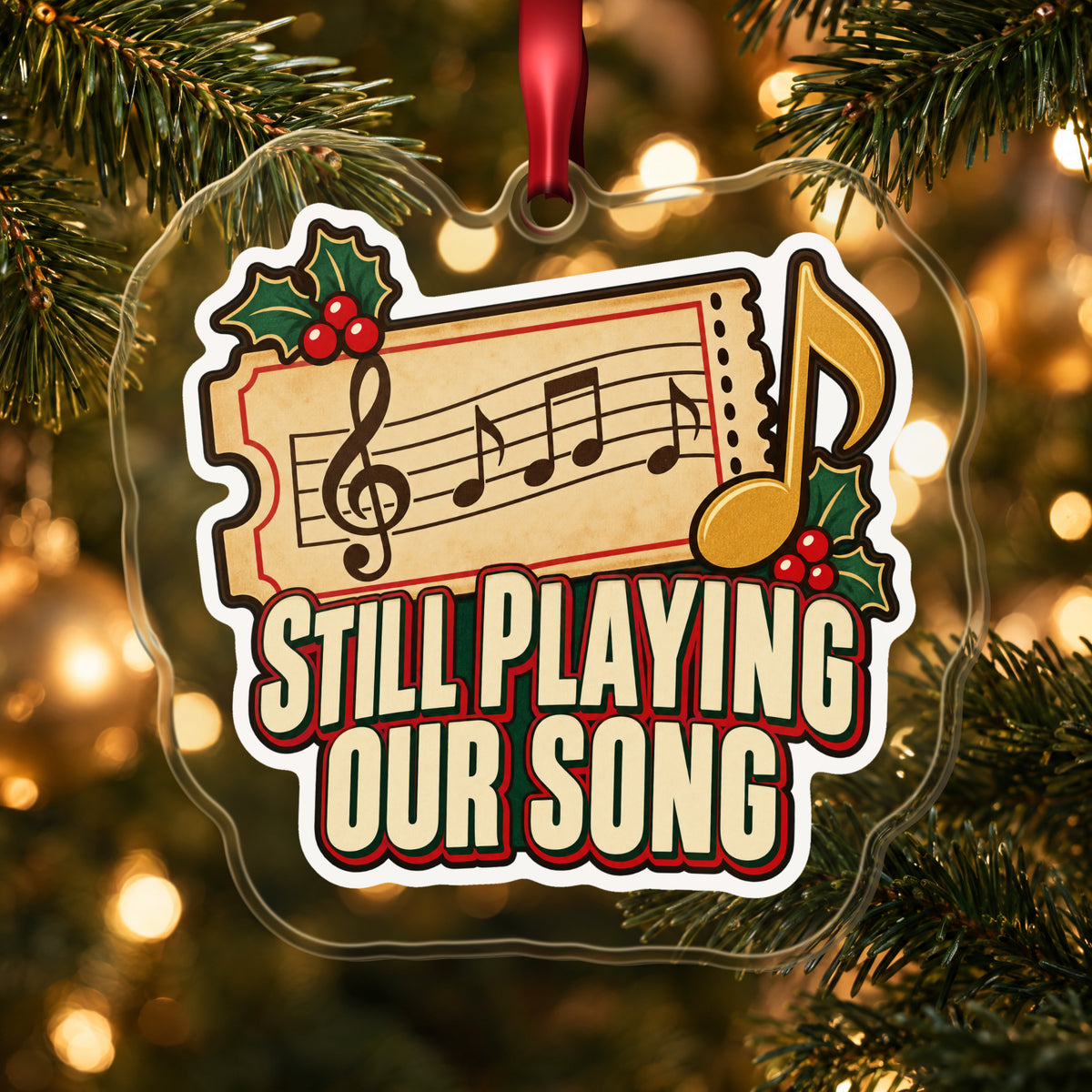 Still Playing Our Song Concert Ticket clear acrylic Christmas ornament hanging on a lit Christmas tree with warm gold lights
