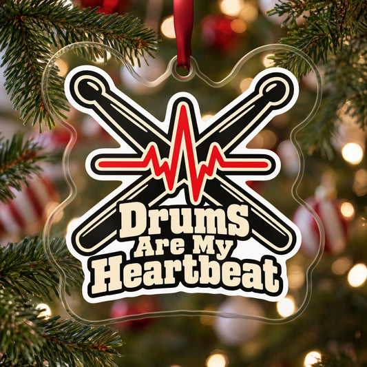 Drums Are My Heartbeat Drumsticks clear acrylic Christmas ornament hanging on a Christmas tree with red and white baubles
