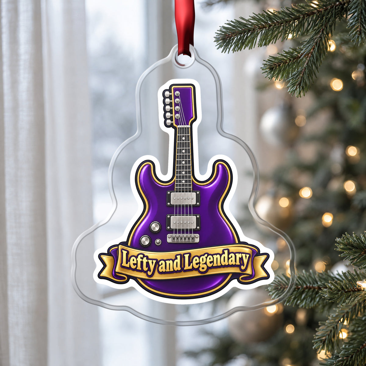 Lefty and Legendary Electric Guitar clear acrylic Christmas ornament hanging on a Christmas tree by a window in soft daylight
