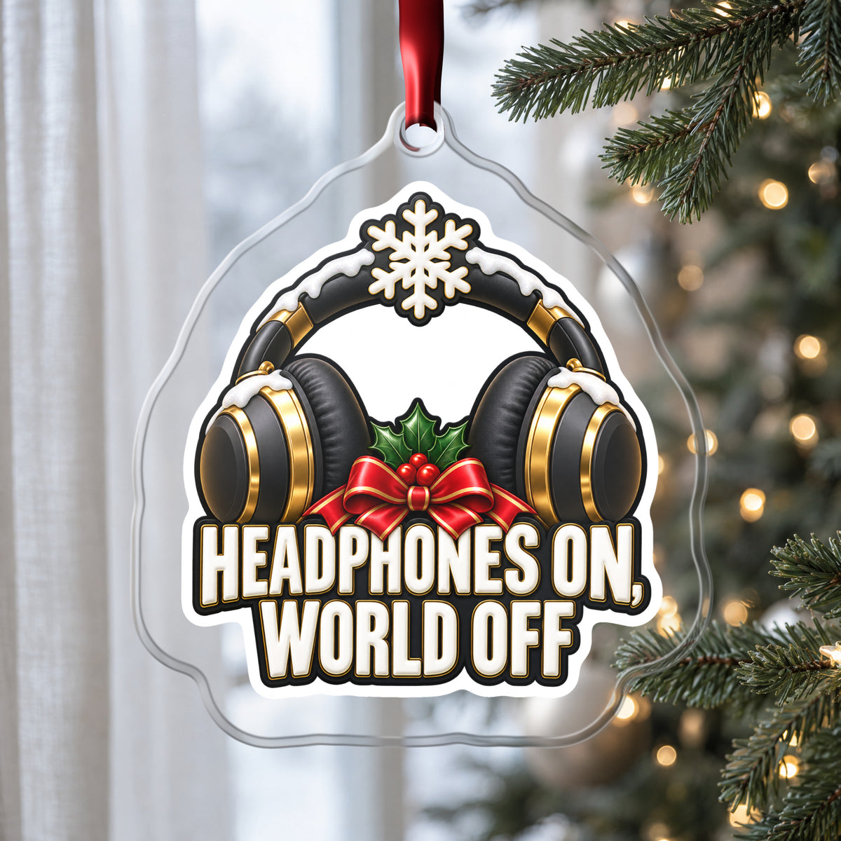 Headphones On, World Off clear acrylic Christmas ornament hanging on a Christmas tree by a window in soft daylight