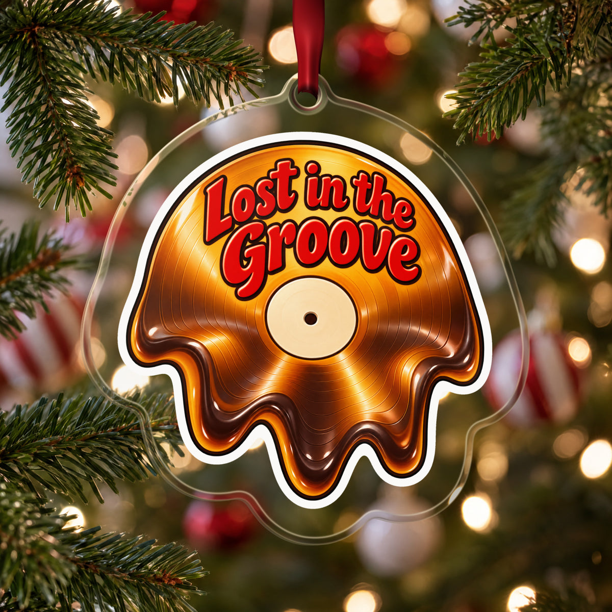 Lost in the Groove Melting Vinyl clear acrylic Christmas ornament hanging on a Christmas tree with red and white baubles