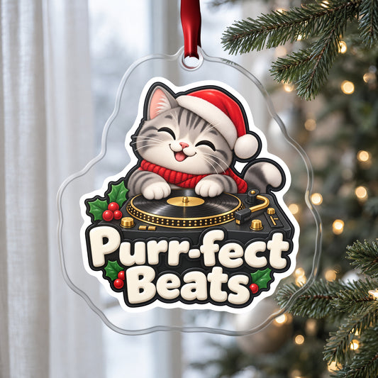 Purr-fect Beats Cat DJ clear acrylic Christmas ornament hanging on a Christmas tree by a window in soft daylight