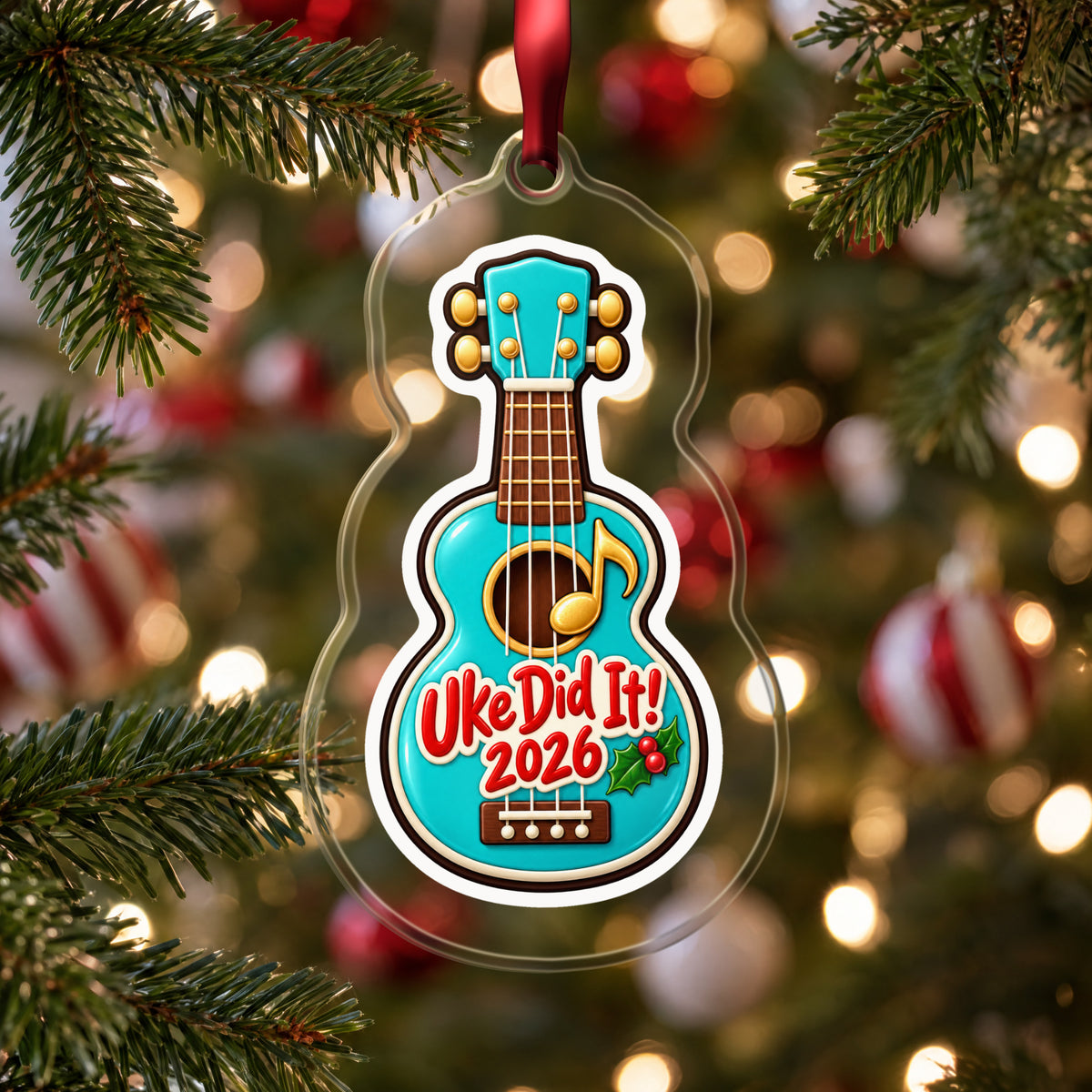 Uke Did It 2026 First Ukulele clear acrylic Christmas ornament hanging on a Christmas tree with red and white baubles