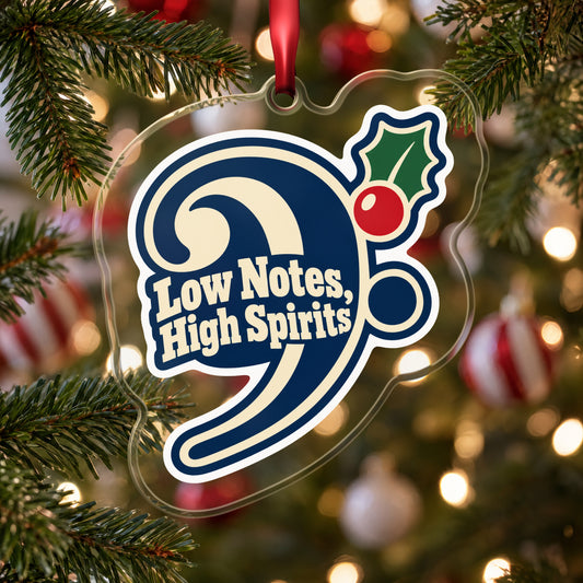Low Notes, High Spirits Bass Clef clear acrylic Christmas ornament hanging on a Christmas tree with red and white baubles