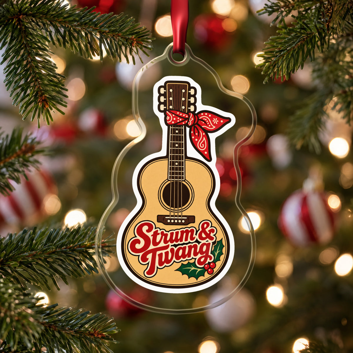Strum & Twang Country Guitar clear acrylic Christmas ornament hanging on a Christmas tree with red and white baubles