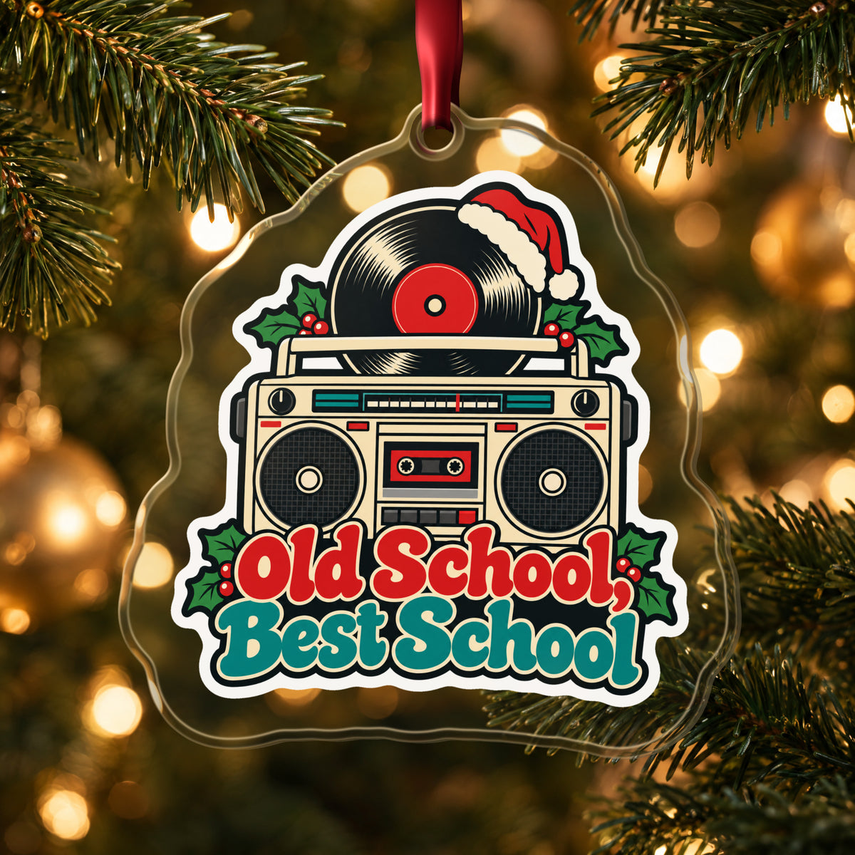 Old School, Best School Boombox clear acrylic Christmas ornament hanging on a lit Christmas tree with warm gold lights