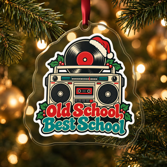 Old School, Best School Boombox clear acrylic Christmas ornament hanging on a lit Christmas tree with warm gold lights
