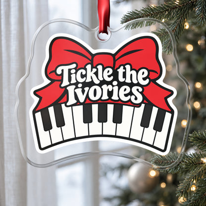 Tickle the Ivories Piano Keys clear acrylic Christmas ornament hanging on a Christmas tree by a window in soft daylight