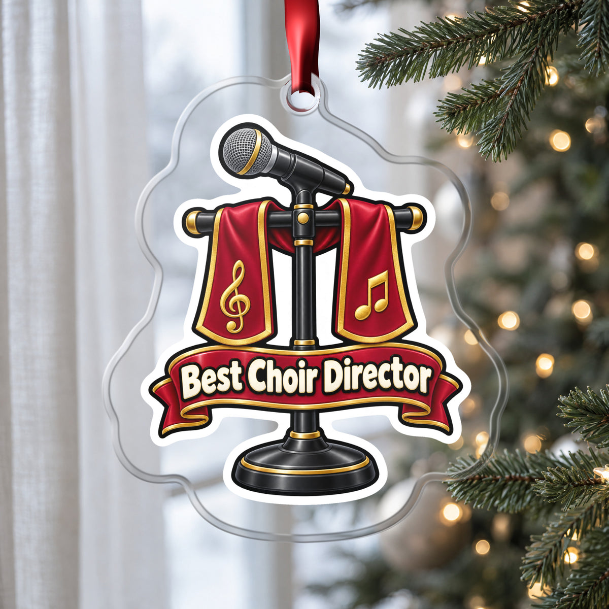 Best Choir Director clear acrylic Christmas ornament hanging on a Christmas tree by a window in soft daylight
