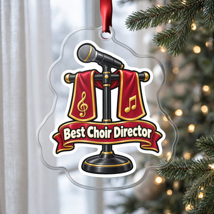 Best Choir Director clear acrylic Christmas ornament hanging on a Christmas tree by a window in soft daylight