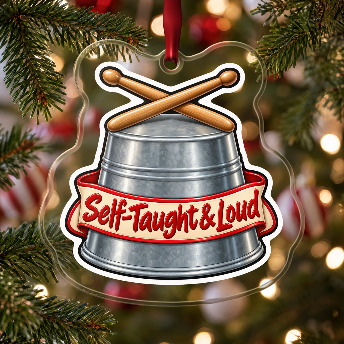 Self-Taught & Loud Bucket Drummer clear acrylic Christmas ornament hanging on a Christmas tree with red and white baubles