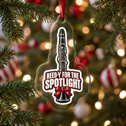 Reed-y for the Spotlight Clarinet clear acrylic Christmas ornament hanging on a Christmas tree with red and white baubles