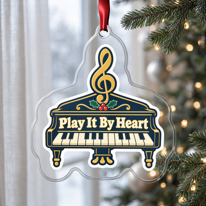 Play It By Heart Grand Piano clear acrylic Christmas ornament hanging on a Christmas tree by a window in soft daylight