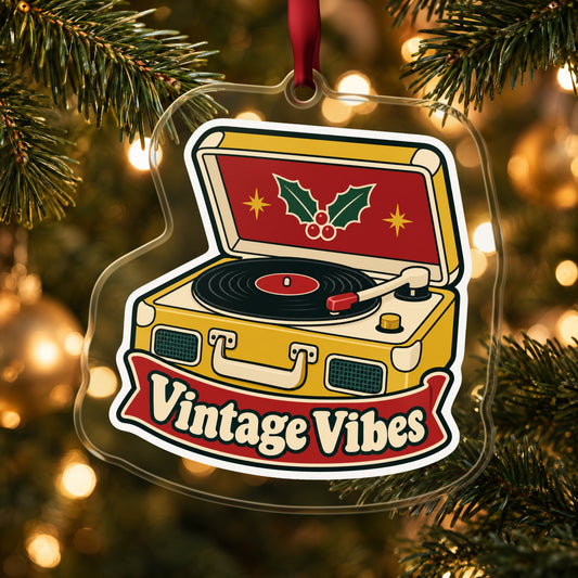 Vintage Vibes Record Player clear acrylic Christmas ornament hanging on a lit Christmas tree with warm gold lights