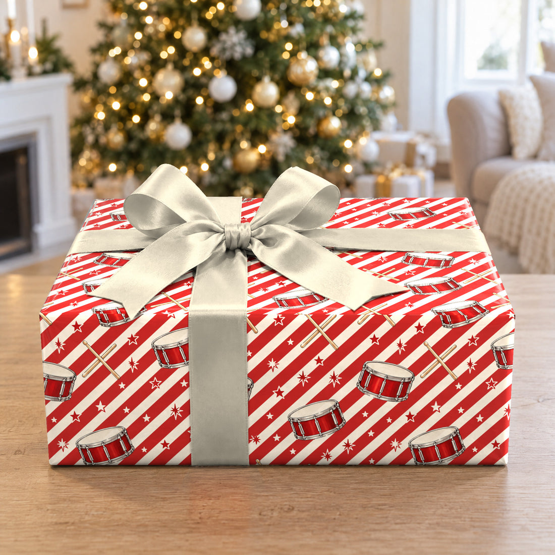 A gift wrapped in Peppermint Drumstick Stripe Wrapping Paper in front of a Christmas tree