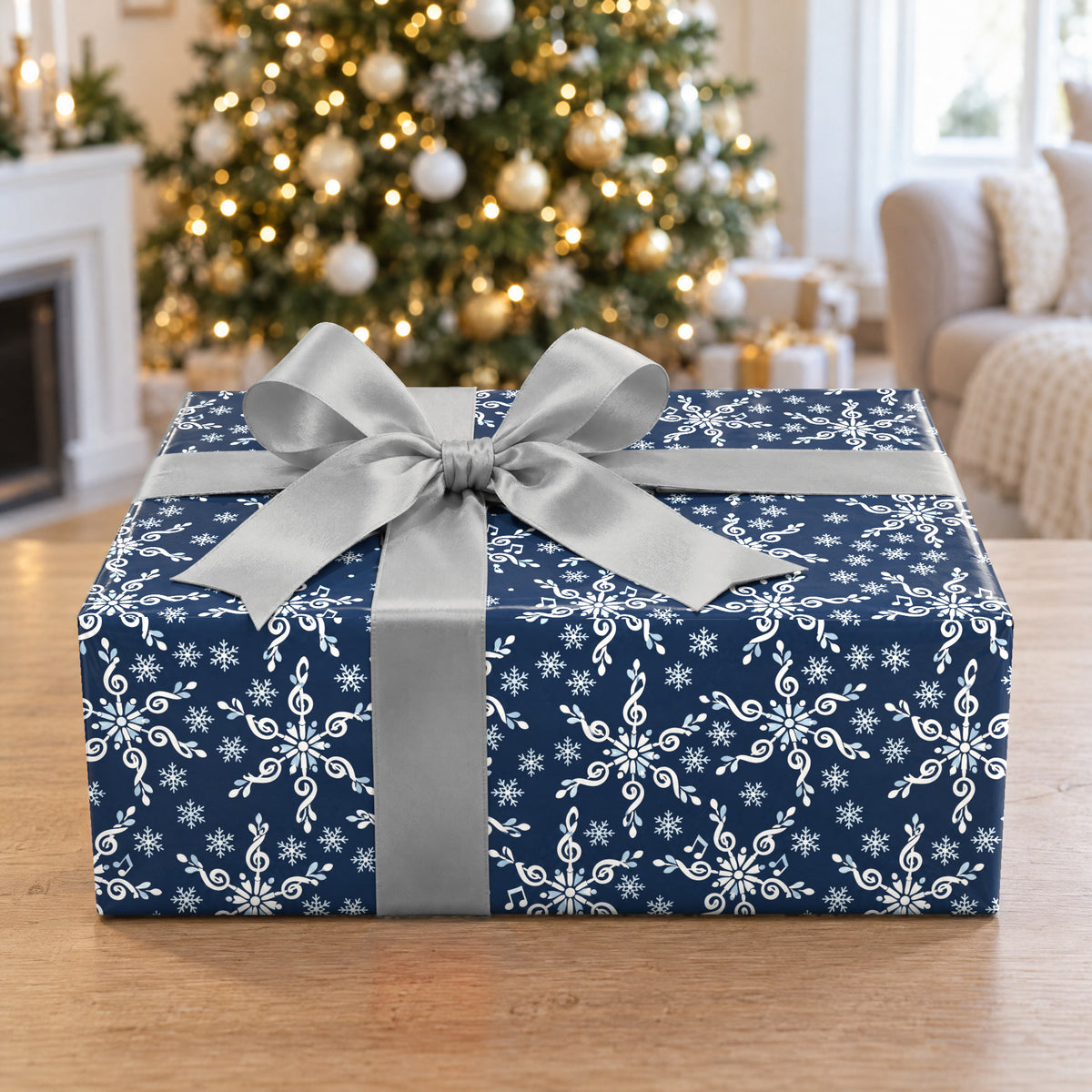 A gift wrapped in Treble Clef Snowflakes Wrapping Paper in front of a Christmas tree